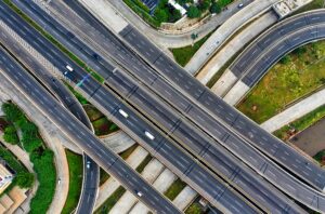 High-altitude shot of a bustling intersection in South Jakarta's expressway system.